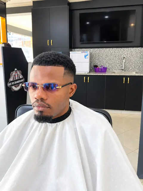 Haircut and fade in progress at GEE M'S Barbershop, Nairobi, photo 3